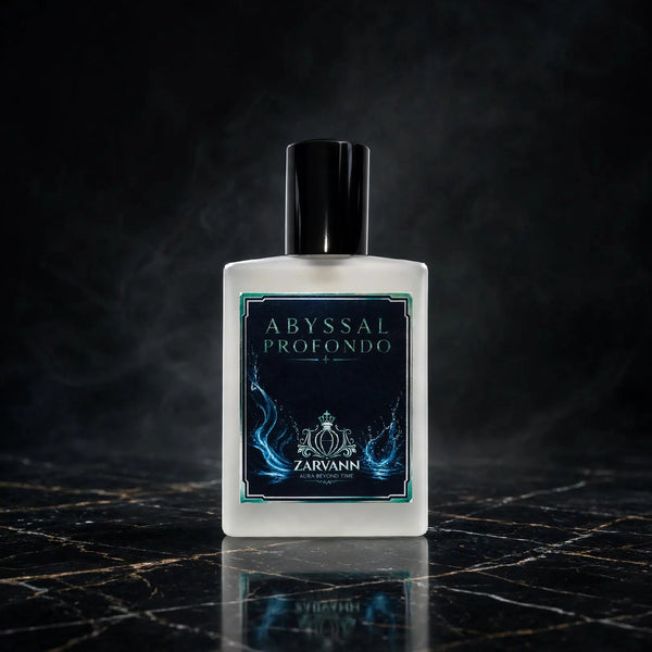 A square frosted glass bottle of Zarvann Abyssal Profondo fragrance, featuring a black cap and a dark navy label with blue flame-like graphics, set on a dark marble surface with a smoky background.